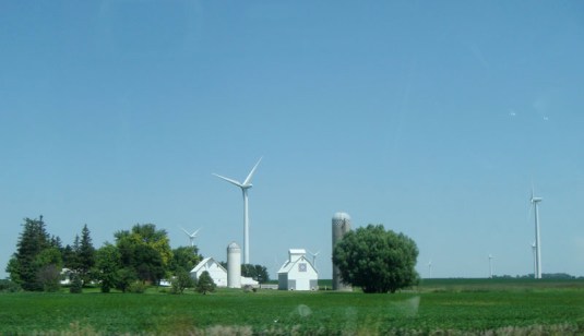 iowa farm with wind tower and traditional swedish painting on barn